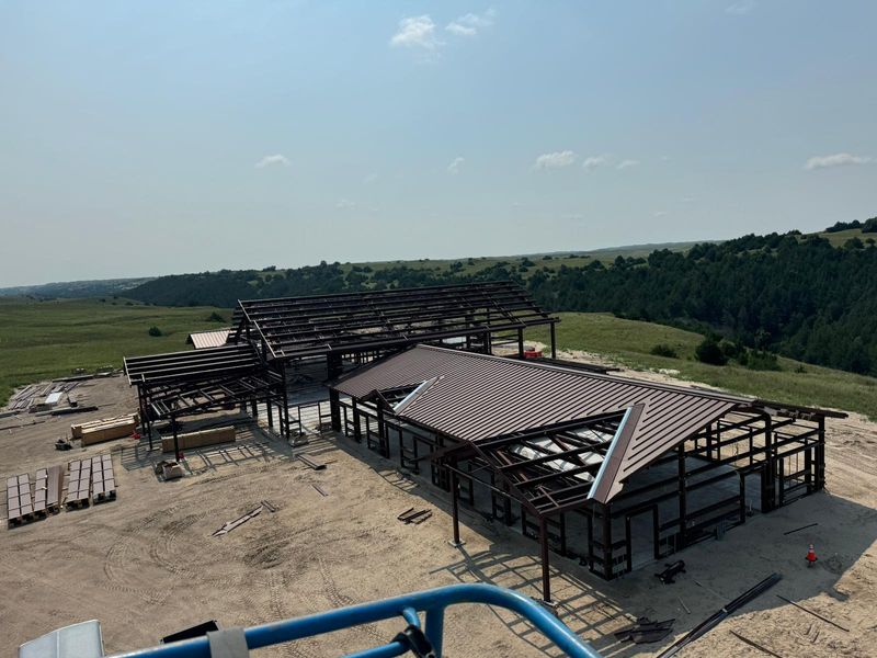 Steel frames and brown roof panels going up near Mullen, Nebraska, seen from a lift